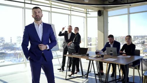 Male leader discussing work at office