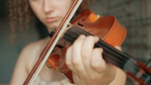 Woman Plays Violin Close Up