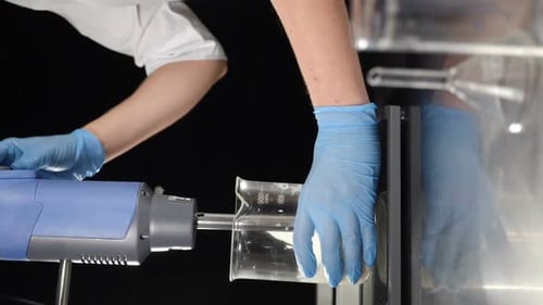 Close Up of Scientist Mixing Chemical Compounds