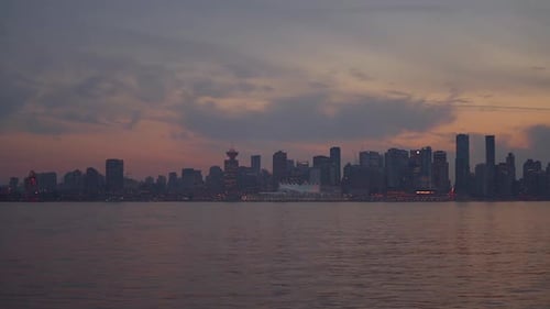 Vancouver timelapse, view from harbor side Place over Vancouver harbor of lit city at night