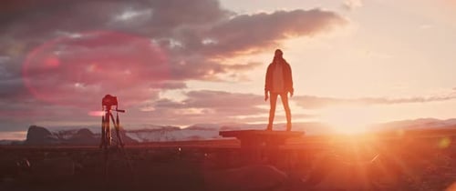 Person Stands on Platform at Sunrise in Wilderness