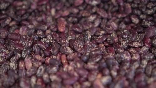 A Pile of Red Beans on the Market Close-up. The Camera Moves. Slow Motion.