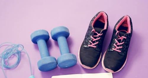 Overhead View of Fitness Equipment on Purple Surface