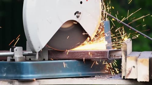 People Cutting Metal Saw for Welding Sparks Material. Worke Tool Sawing Close Up