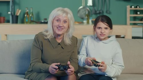 Grandmother and Grandchild Enjoying Video Games Together