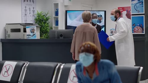 Masked People at Hospital Reception Desk