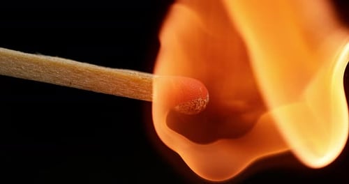 Igniting Match Flame in Extreme Close-up View