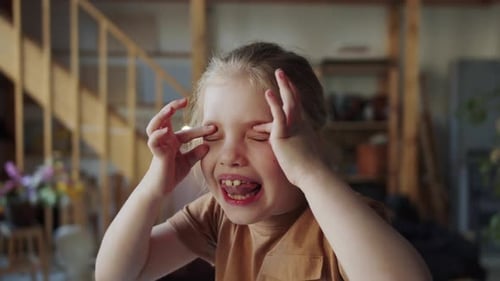 Teen Girl Makes Ugly Faces and Grimaces at the Camera