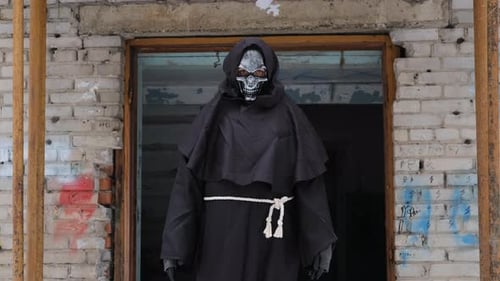 Grim Reaper Over Abandoned Brick Building