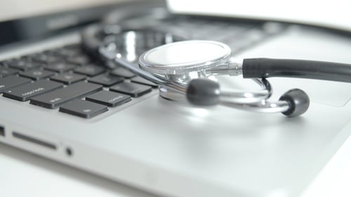 Stethoscope on a Laptop Keyboard Close Up