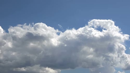 Clouds Drifting Across a Blue Sky