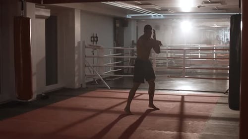 Boxing, Athletic Man Fighter Trains His Punches, Training Day in the Boxing Gym.