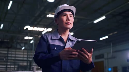 Engineer Using Tablet in Factory Workplace