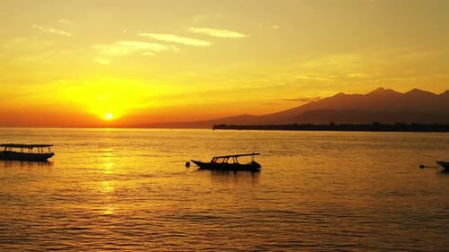 Aerial above panorama of tranquil seashore beach lifestyle by blue sea and white sand background of
