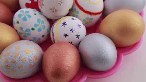 Colorful Decorated Easter Eggs in Pink Plate