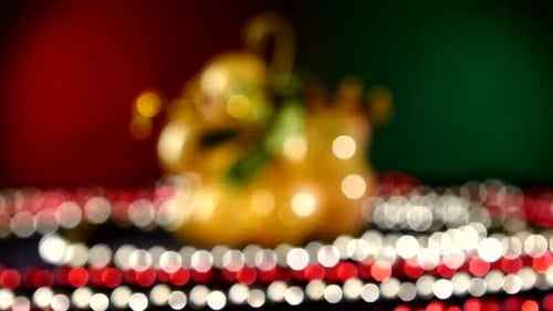 Toy Like Grapes for Christmas or New Year and Beads, Rotation, on Red and Green, Bokeh, Dynamic