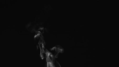 Rising White Smoke on Black Background