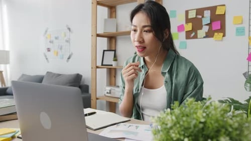Young Adult in Video Conference at Home Office