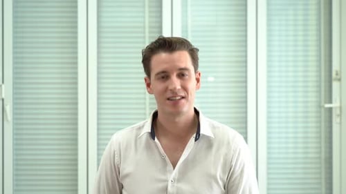 Smiling Man Portrait in Modern Workplace Environment