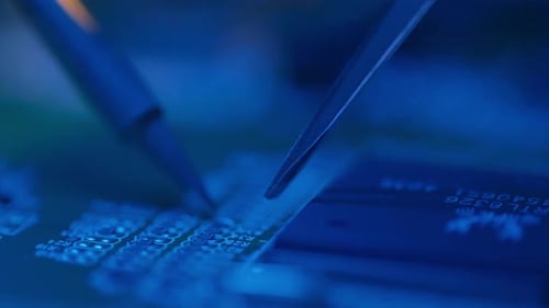 Circuit Board Repair with Soldering Iron and Tweezers