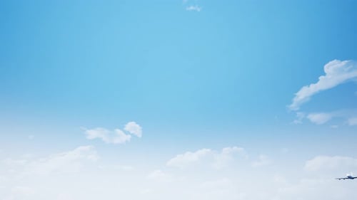 Passenger Airplane Flying Through a Sunny Blue Sky