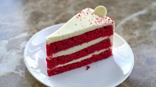 Red Velvet Cake Being Cut with a Fork