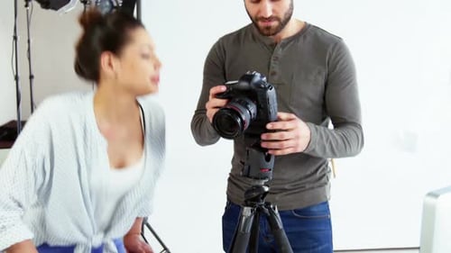 Photography Team Reviews Images on Camera in Studio
