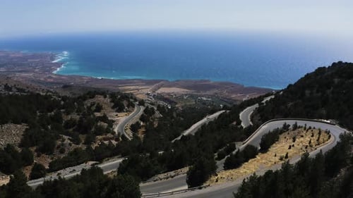 Aerial view of Windy Road in Mountain near Mediterranean Sea. Flying above Mountain