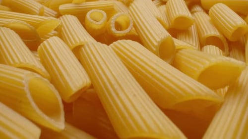 Close Up of Uncooked Penne Pasta Noodles