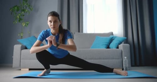Woman Doing Lateral Lunge Exercise at Home