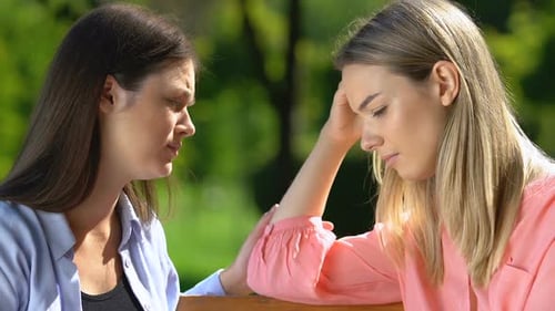 Best Friend Supporting and Comforting Sad Crying Female in Park, Trust and Care