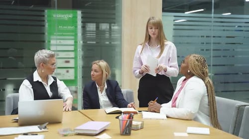 Businesswomen Meeting in Modern Office Boardroom