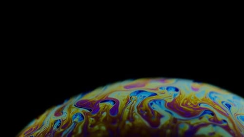 Multicolored Rainbow Colors of a Single Soap Bubble That Looks Like a Fantasy Planet Isolated