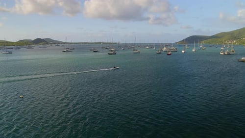 Boats moored at a distance at marina harbor, Le Marin