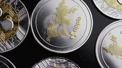 Close Up of Silver and Gold Ripple Coins
