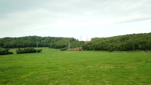 Aerial View of Sunset with Fog Above Forest and Mountains