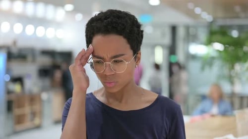 Portrait of Stressed Casual African Woman Having Headache