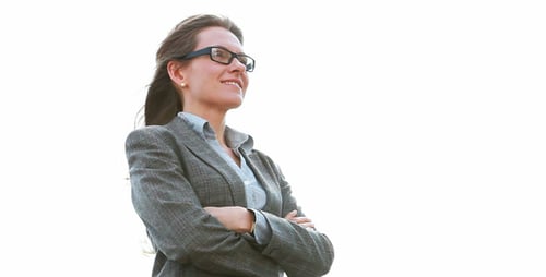 Confident Businesswoman With Arms Crossed Stands Outdoors