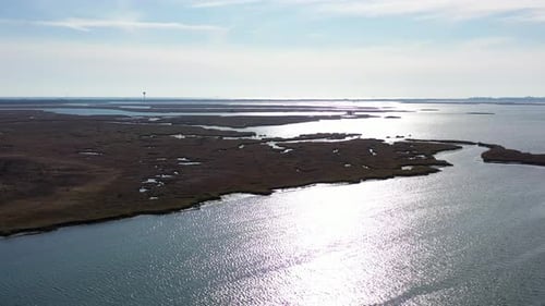 landing over the salt marshes of Baldwin Bay. It's a fall day & in view is the marsh area & then the
