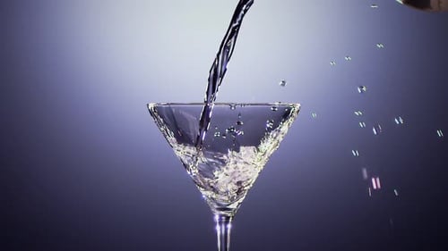 Liquid is Poured Into Martini Glass in Close Up