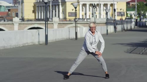 Active Senior Woman Exercising Outdoors