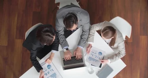 Business Team Analyzing Statistics