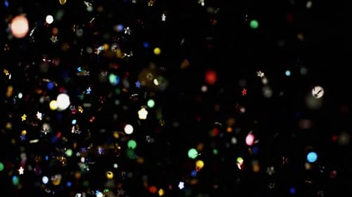Multicolored Confetti Flying After Being Exploded Stars and Hearts Particles Flying and Falling Down