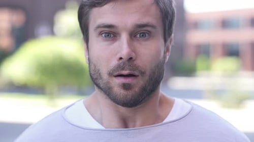 Man Displays Expression of Surprise Close Up