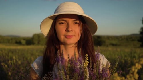 Portrait Woman with Bouquet of Field Flowers