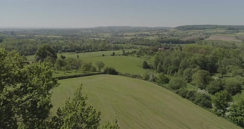 Pastoral Green Fields and Wooded Landscape Aerial View