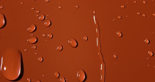 Abstract water drops on brown background, macro