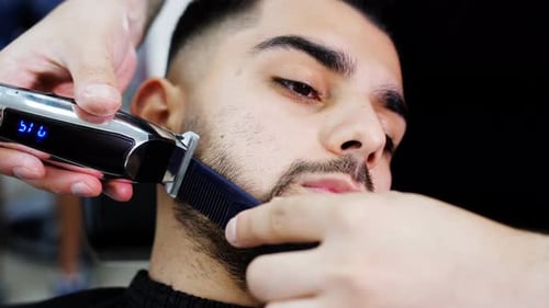 Man Getting Beard Trimmed at Barber Shop