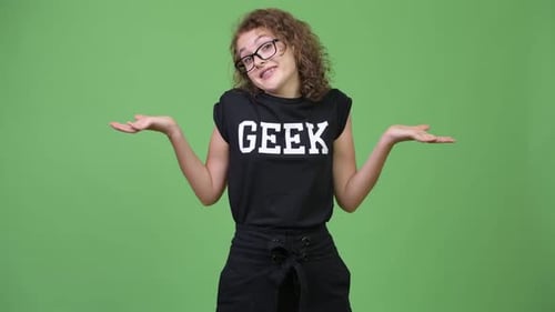 Young Woman Shrugs Shoulders with Open Arms