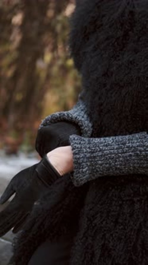 Woman Wearing Black Gloves and Coat in Park
